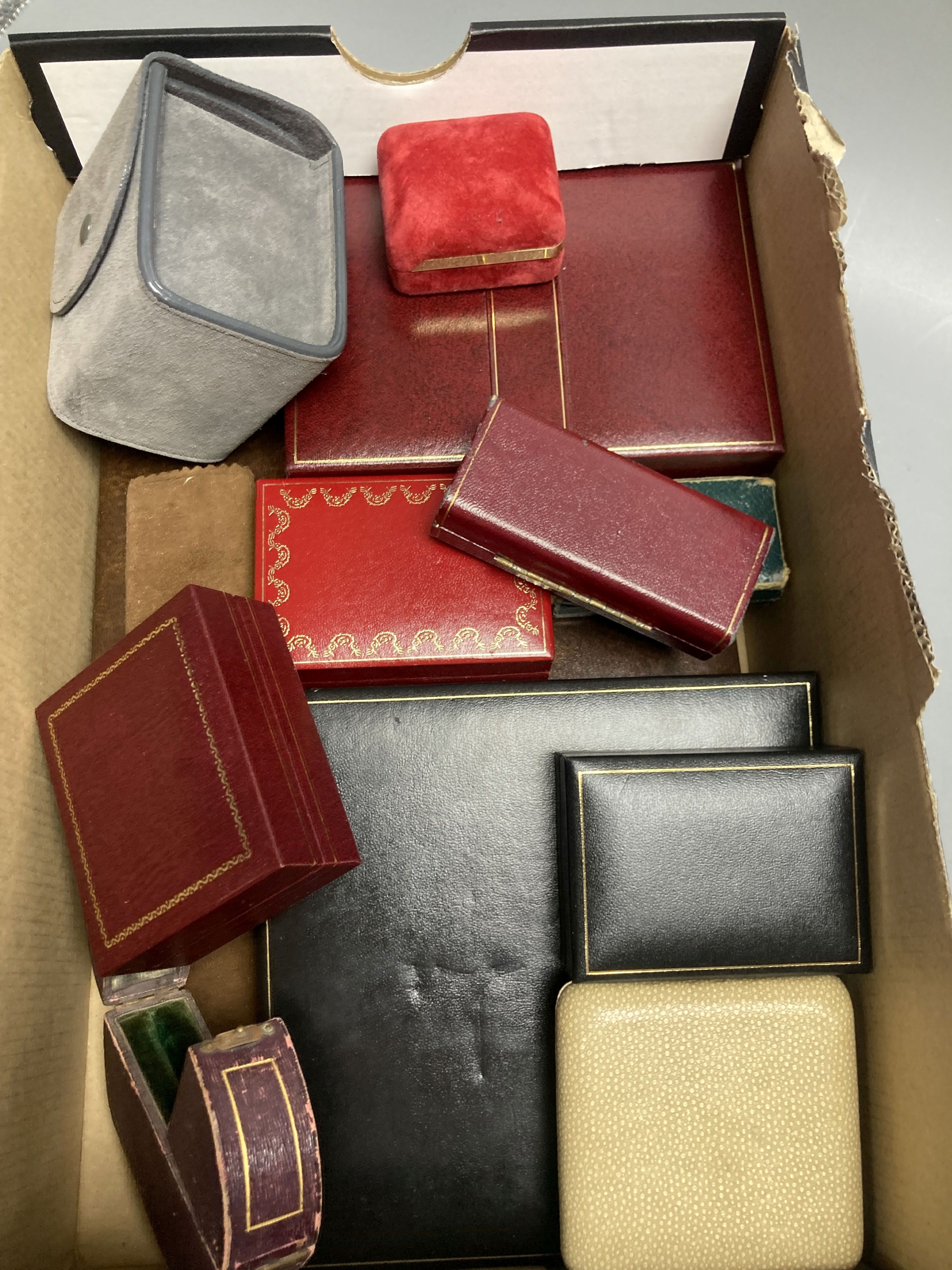 Twelve assorted jewellery boxes including Must de Cartier, Cartier and a Van Cleef & Arpels pouch.